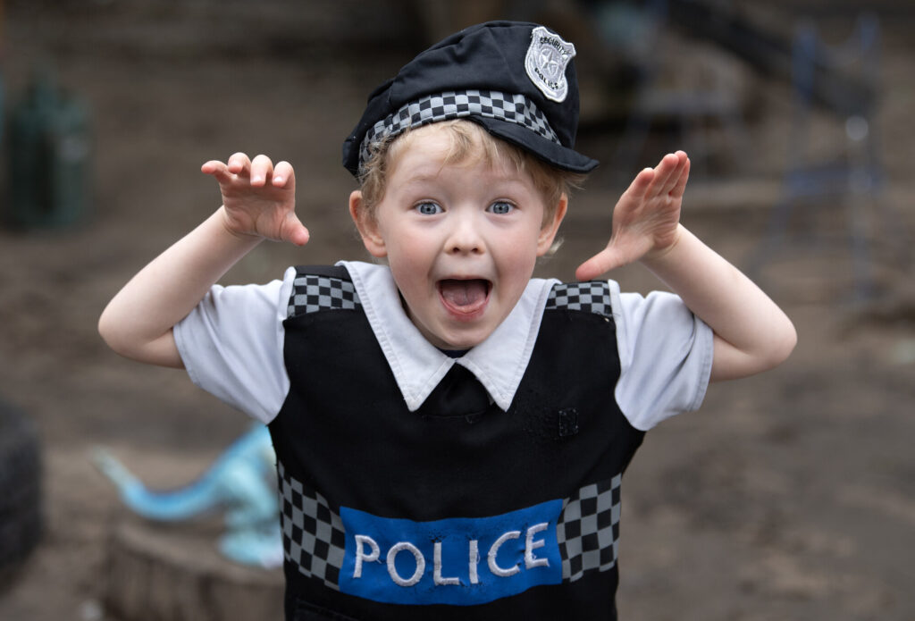 Little boy smiling and looking happy at The Yard