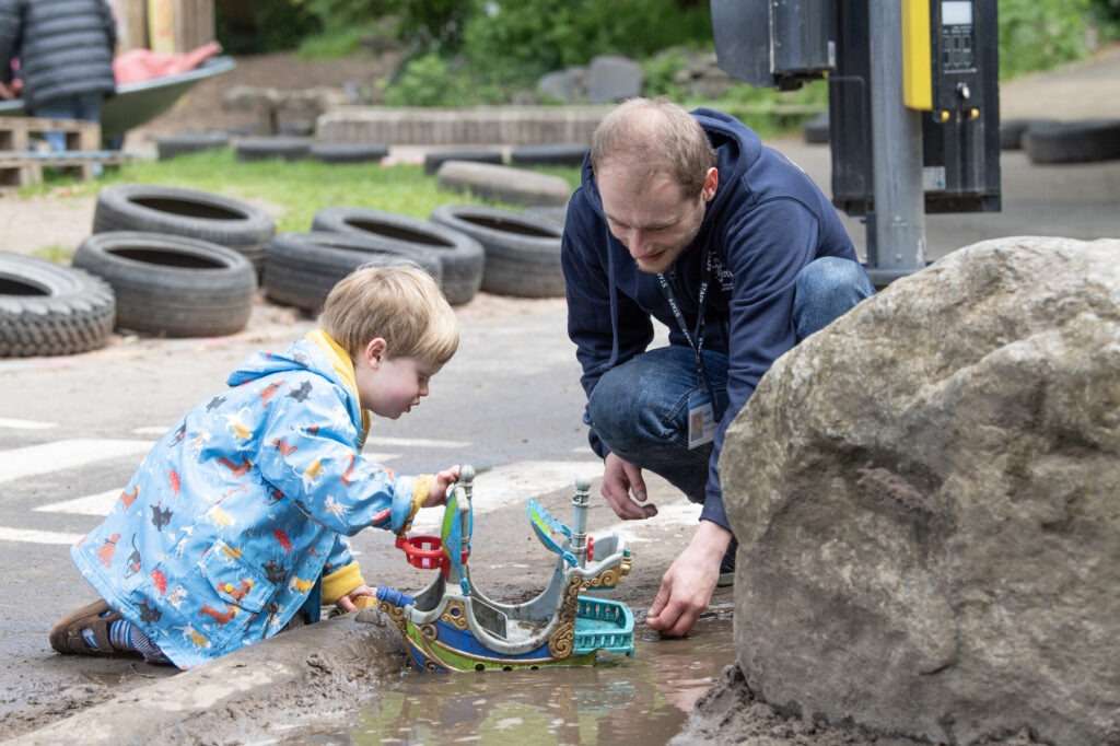 Yard playworker Jamie with little boy