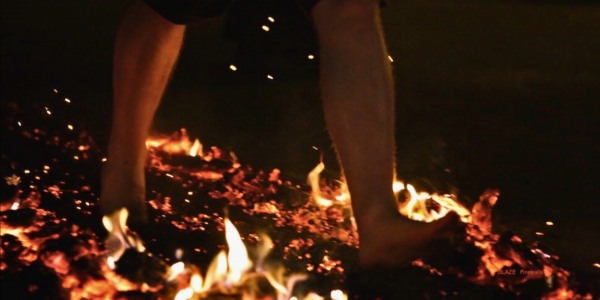 person walking on hot embers during The Yard Firewalk